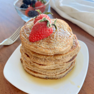stack of healthy pancakes with strawberries on top