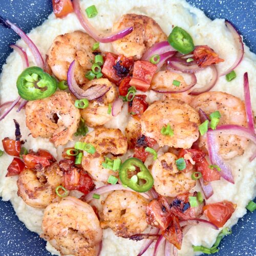 shrimp and grits in a pan very colorful