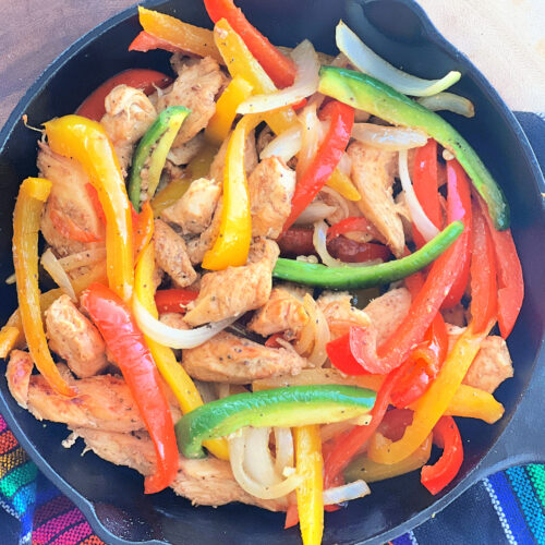 Chicken fajitas in a large bowl