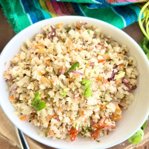 cauliflower rice with veggies in a white bowl